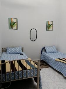 Postel nebo postele na pokoji v ubytování Homestay Bonda D'