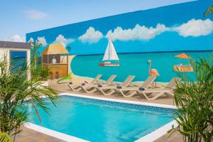 a mural of a swimming pool with a sailboat at Mosch Apartments in Noord