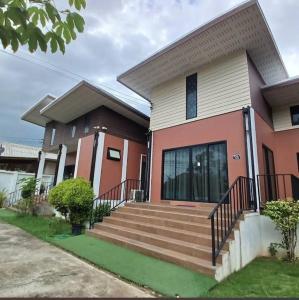 a house with a staircase in front of it at River Bend Villas in Mae Rim