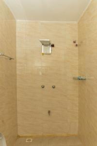 a bathroom with a shower stall with a toilet at Grato Pacho in Kisumu +74 photos