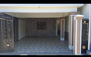an empty room with a wall of wine bottles at Constanza Family House in Constanza