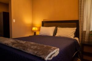 Postel nebo postele na pokoji v ubytování Casa Vista Baúl