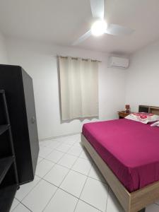 En eller flere senge i et værelse på Le Frangipagnier Appartement T2 Centre ville