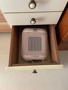 a television in a drawer in a cabinet at kumanonisumu! in Kumano