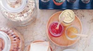 a table with a plate of food and a drink at At home boutique in Ban Long