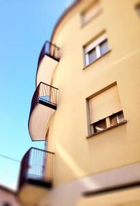 a building with balconies on the side of it at Casa Julia in Cividale del Friuli