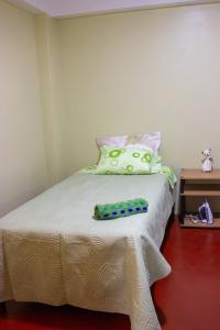 Giường trong phòng chung tại Posada del Carmen