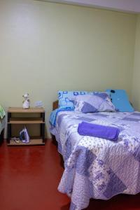 Giường trong phòng chung tại Posada del Carmen