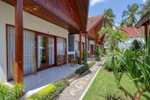 an exterior view of a house with a patio at Lavanya Villa in Nusa Penida