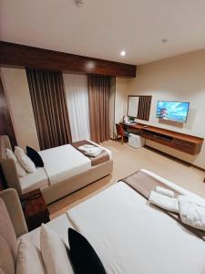 Postel nebo postele na pokoji v ubytování Violet Hotel