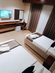 Postel nebo postele na pokoji v ubytování Violet Hotel