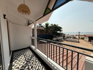 a balcony with a view of the beach at Baga Sea shine in Baga