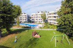 an aerial view of a park with a playground at Lukas Studio in Ustronie Morskie