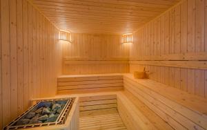 a wooden sauna with a tub in the middle at Mansion 51 Hotel & Apartment in Phnom Penh