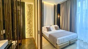 En eller flere senge i et værelse på Boutique Hotel Cordial Galdós Jardín