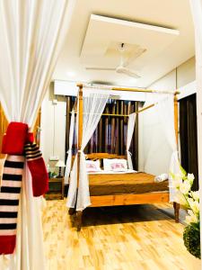 a bedroom with a bed and a book shelf at Pinevilla homestay in Jorhat