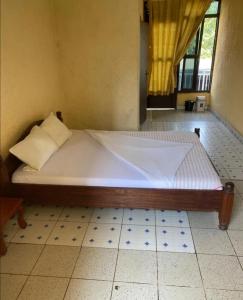 En eller flere senge i et værelse på Viva Lodge