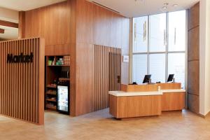 a waiting area in a store with a martacistacistasteryasteryasteryasteryastery at Courtyard by Marriott Mexicali in Mexicali