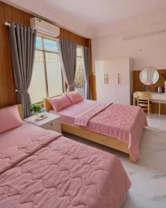 En eller flere senge i et værelse på Sary's Homestay