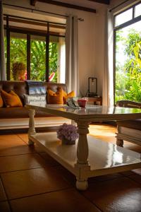 a coffee table in a living room with a couch at Casa Los Madriz Suite #2 in San Isidro