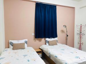 Giường trong phòng chung tại 聖甲虫空間