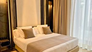 En eller flere senge i et værelse på Boutique Hotel Cordial Galdós Jardín