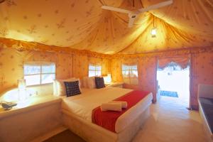 a bedroom with a bed in a tent at Dolphin Beach Resort in Kalpitiya