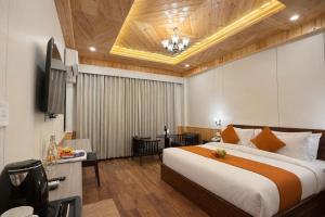 Giường trong phòng chung tại Snow Apple Resort by West Western - Central Heated Room and Air Cooled
