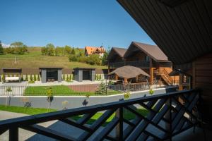 a view of a house from a balcony at Шепіт Карпат in Yasinya