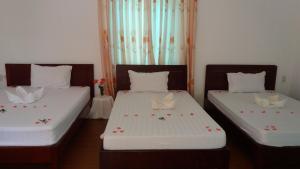 Postel nebo postele na pokoji v ubytování Mango Garden Hoi An Homestay