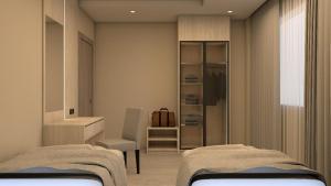 En eller flere senge i et værelse på Karim Hotel