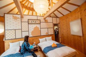 Postel nebo postele na pokoji v ubytování GRAND CHARIOT Hokutoshichisei 135°