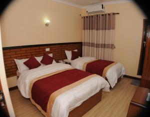 Letto o letti in una camera di Hotel Bagmati