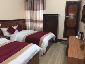 Letto o letti in una camera di Hotel Bagmati
