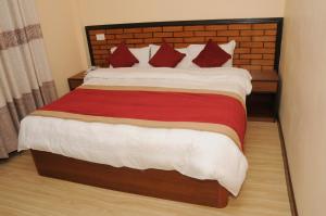Letto o letti in una camera di Hotel Bagmati