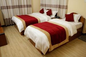 Letto o letti in una camera di Hotel Bagmati