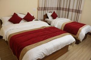 Letto o letti in una camera di Hotel Bagmati