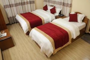 Letto o letti in una camera di Hotel Bagmati