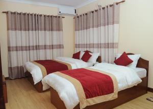 Letto o letti in una camera di Hotel Bagmati