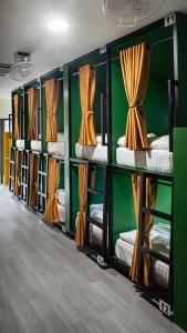 a row of bunk beds in a room at The Highdogs Hostel in Phi Phi Islands