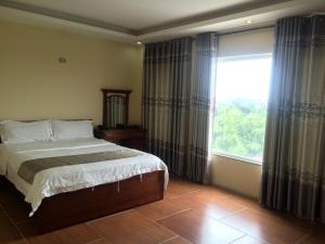 Postel nebo postele na pokoji v ubytování Chio Hotel