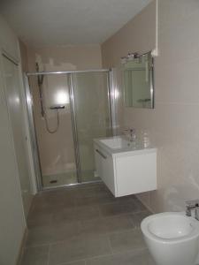 a bathroom with a shower and a toilet and a sink at Les pieds dans la mer Best place in Villefranche-sur-Mer