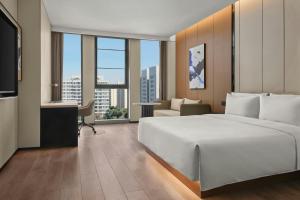 En eller flere senge i et værelse på Fairfield by Marriott Shanghai Qingpu