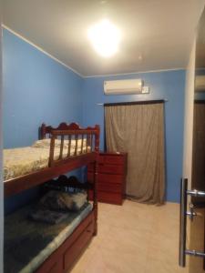 a bedroom with a bunk bed and a window at Casa dois quartos 5 pessoas, no centro de Belém in Belém