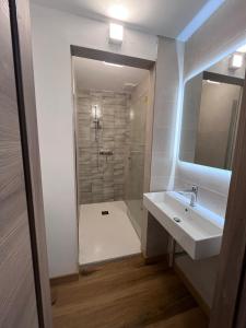 a bathroom with a white sink and a shower at CAMPING VILLAGE Orsa Minore in Campo di Giove +47 photos