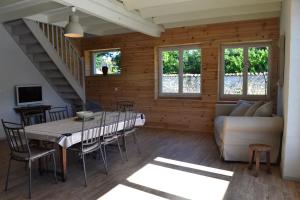 a living room with a table and a couch at La Grange aux Dames in Genac