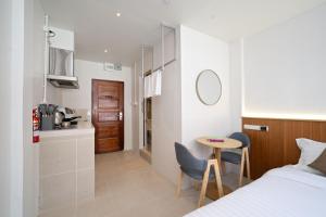 En eller flere senge i et værelse på OH Suites 72 + 36 billeder