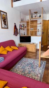 a living room with a bed and a rug at Facing the Sestriere Ski Slopes in Borgata Sestriere