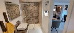 a small bathroom with a toilet and a sink at Gartencharlet in Extertal
