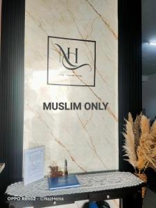 un signe pour amusimemiaemiaemiaemiaemiaemiaemiaemia dans l'établissement NH Stay, Parit Buntar Perak, à Parit Buntar